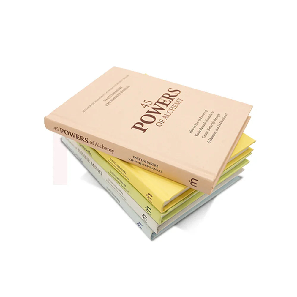 Stack of colorful Vastu remedy books with 45 Powers of Alchemy on top, ideal for positivity