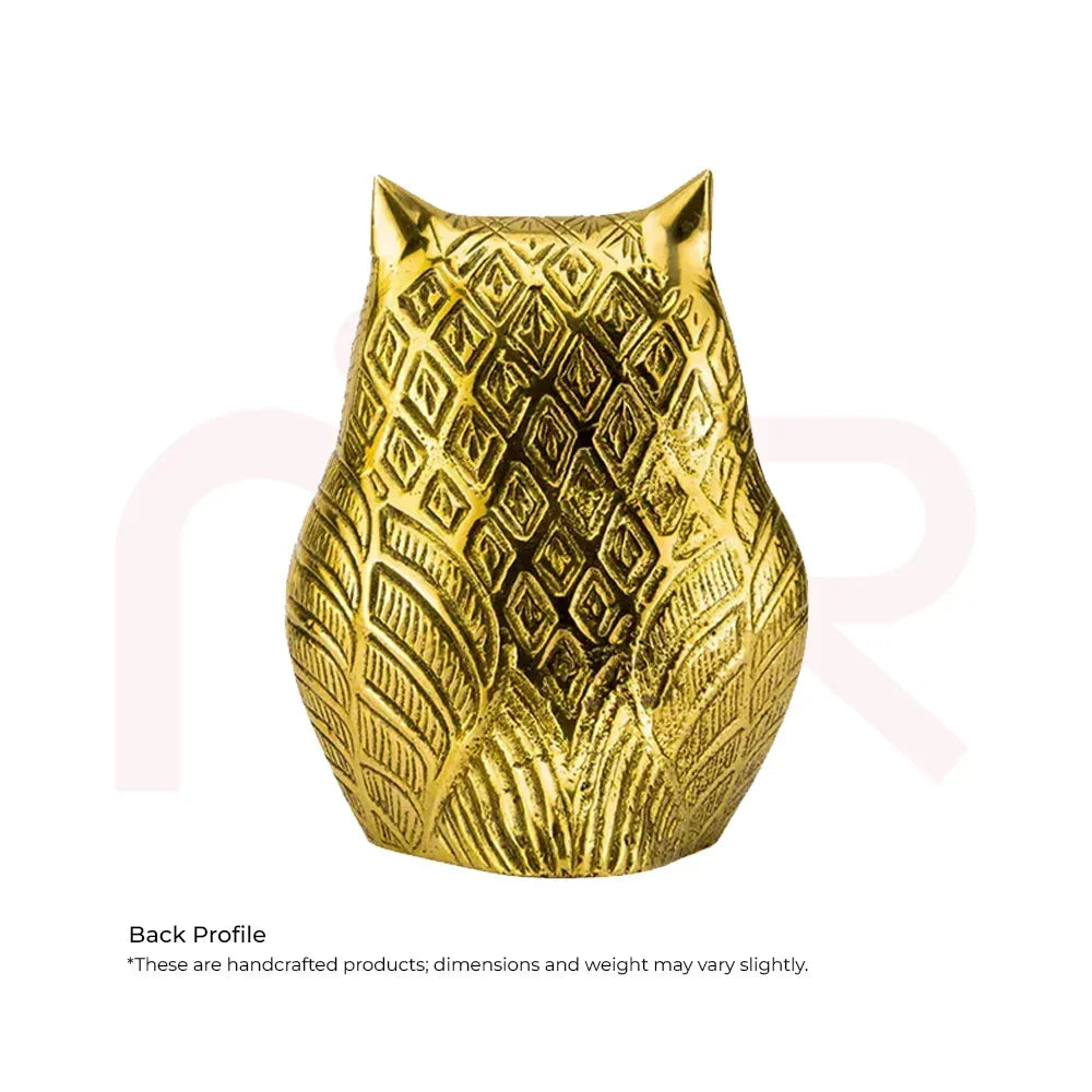 Back view of a golden owl figurine with intricate patterns, Vastu home decor remedy