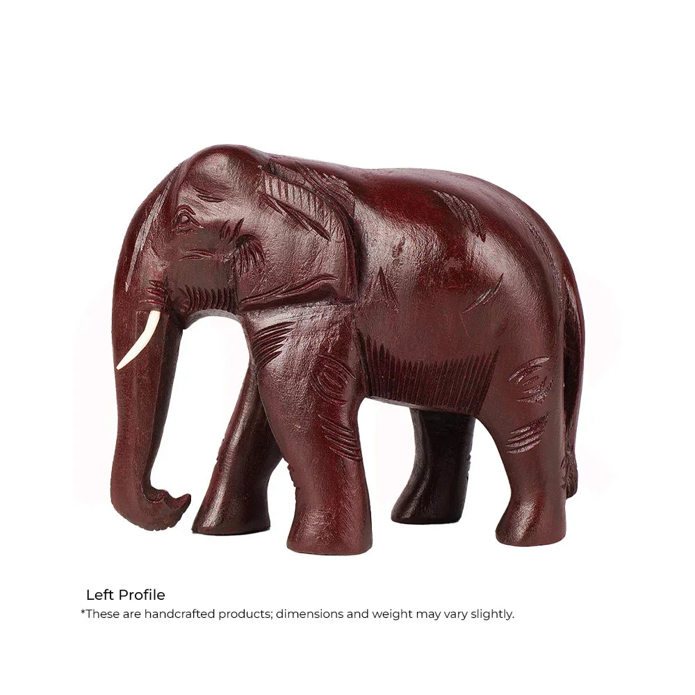 Handcrafted wooden elephant idol for MahaVastu remedies, left profile view, on white background.