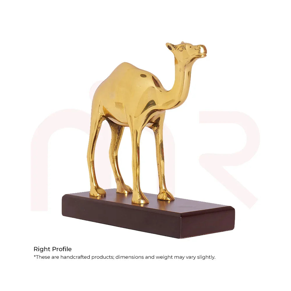 Handcrafted golden camel figurine on a dark base for Vastu Shastra home decor.