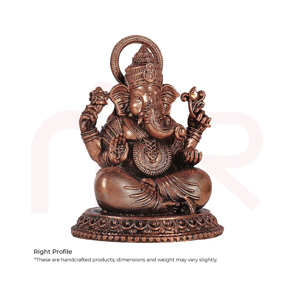 Handcrafted bronze Ganesh idol sitting, detailed Vastu remedy decor for positivity and prosperity