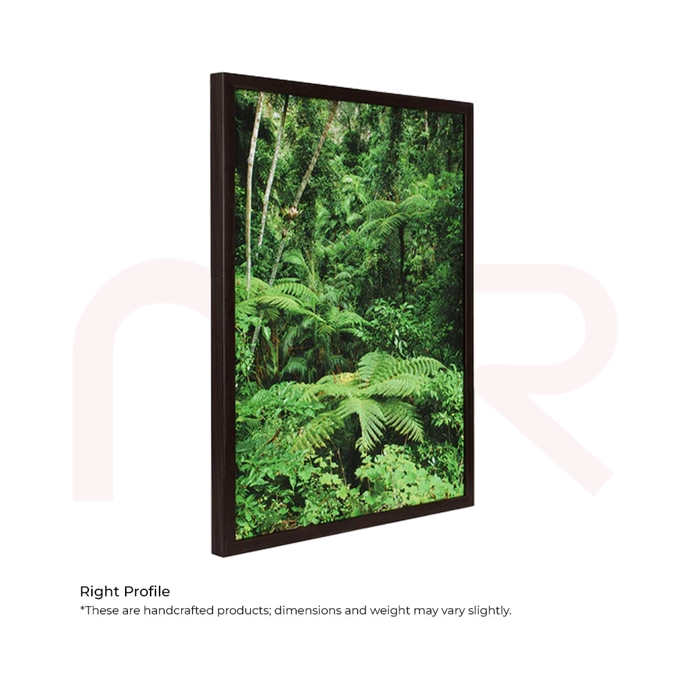Green Vastu canvas painting with lush forest scene in dark frame, MahaVastu remedy decor.