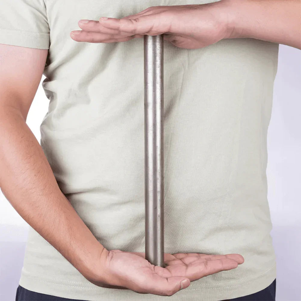 Person holding a vertical iron rod, MahaVastu remedy for Vastu Shastra balance