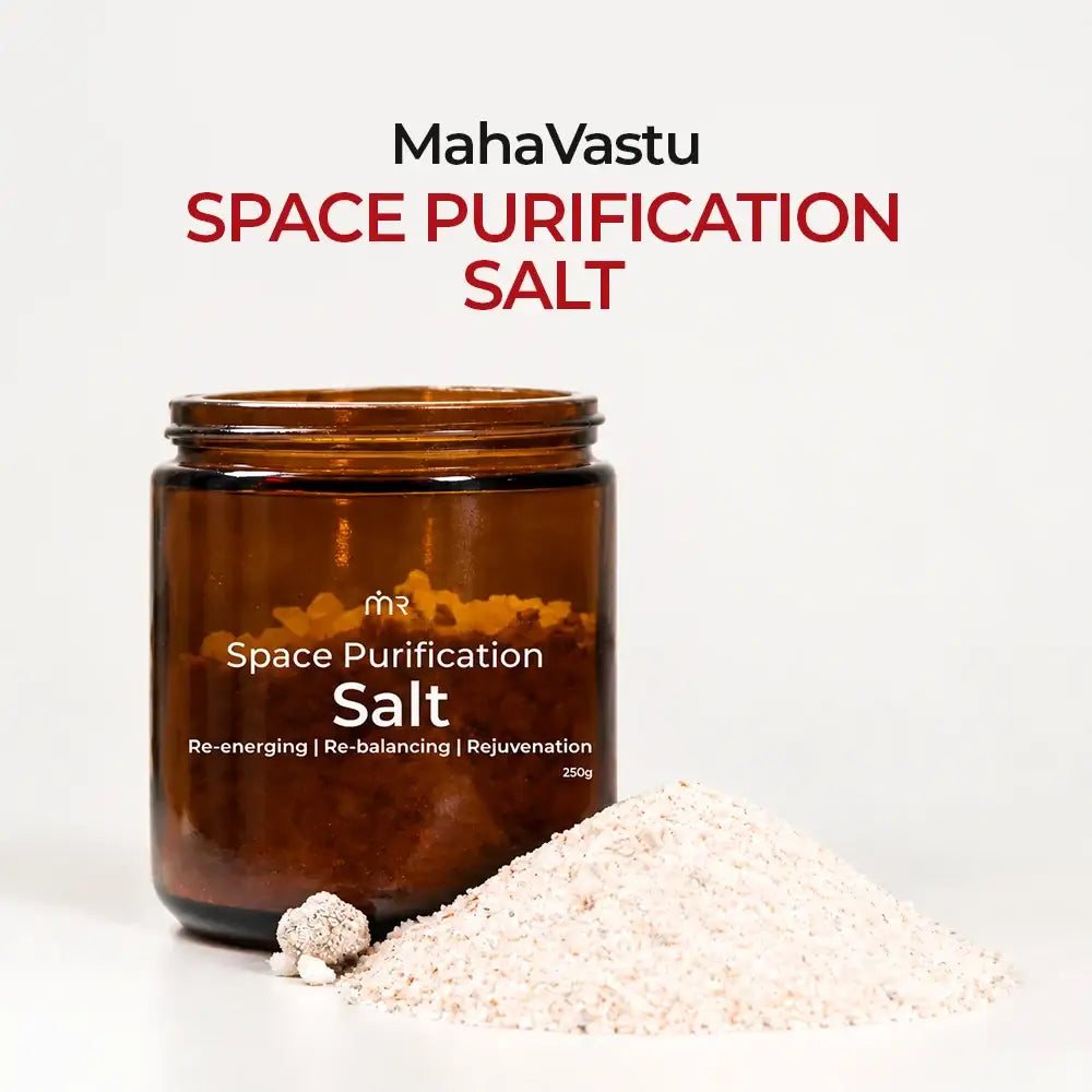 MahaVastu Remedies Space Purification Salt in a brown glass jar with a pile of salt.