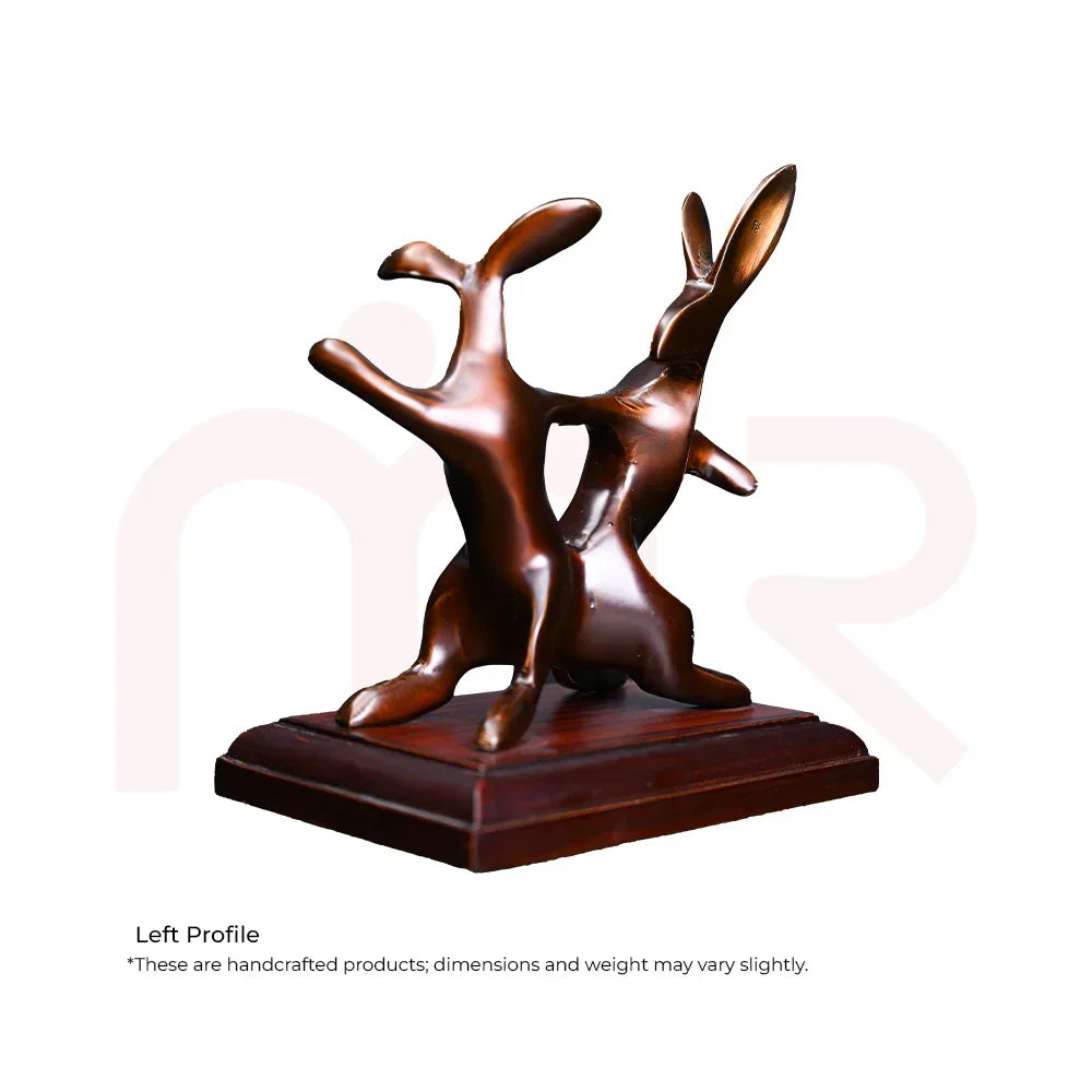 Handcrafted bronze rabbit couple figurine on wooden base, ideal for Vastu decor and positivity