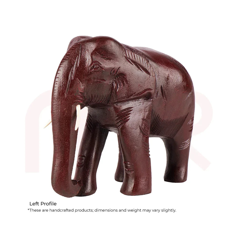 Handcrafted red elephant figurine for Vastu decor, carved wooden ornament.