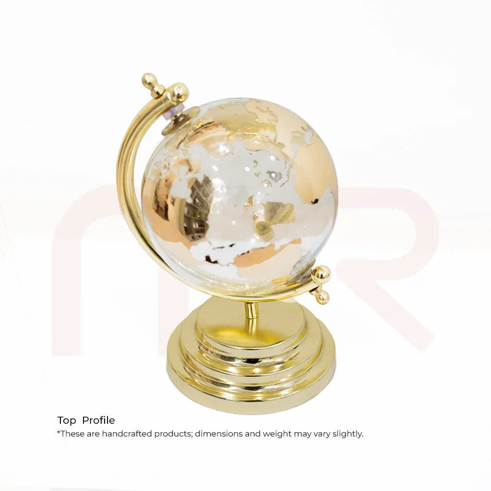 Small decorative glass globe on gold metal stand, Vastu home decor remedy