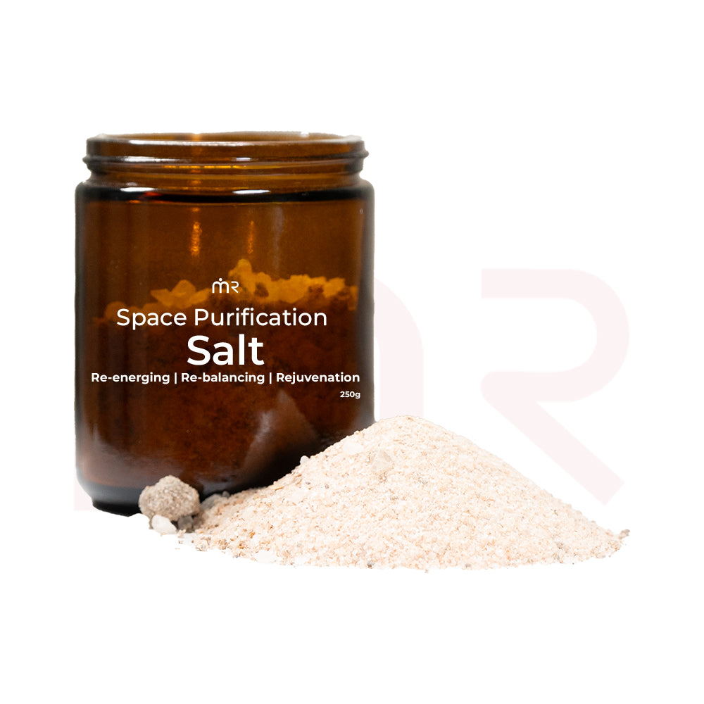 MahaVastu Remedies Space Purification Salt in a brown glass jar with a pile of salt.