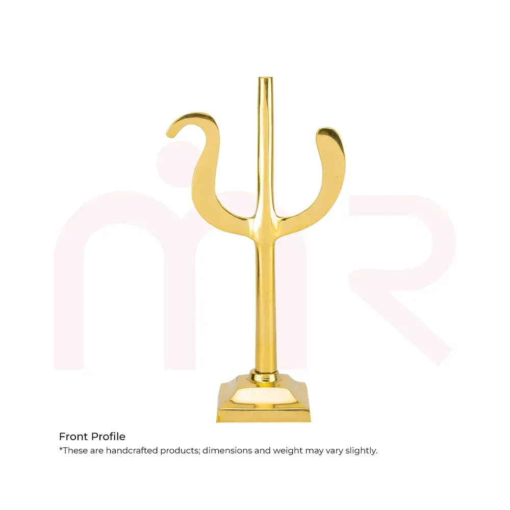 Handcrafted golden brass trishul for Vastu remedies on white background