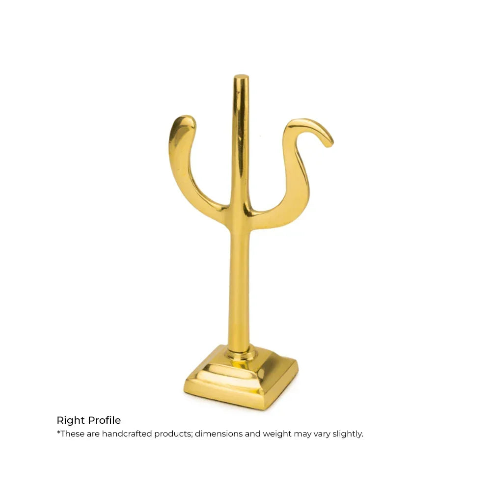 Golden metal trishul Vastu remedy showpiece for home or office decor on white background